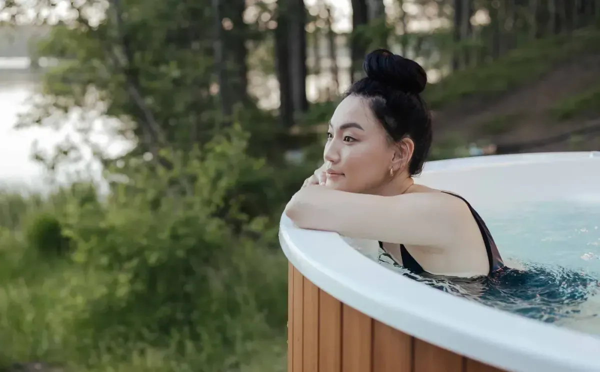 Hot tub with energy-efficient insulation and cover