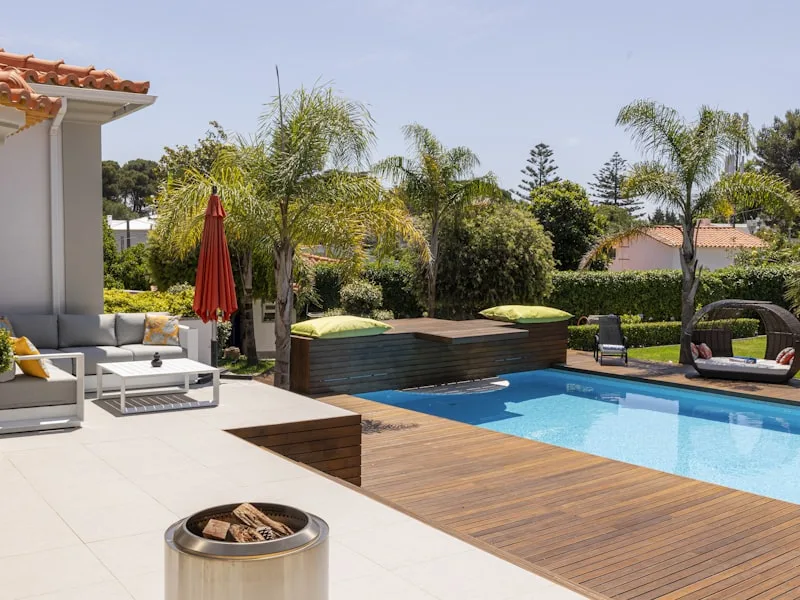 Swim spa with wooden deck and lounge area